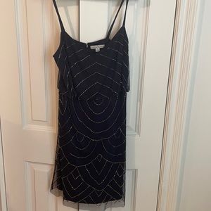 Size 8 navy dress with stunning beading detail. Worn once, great condition.